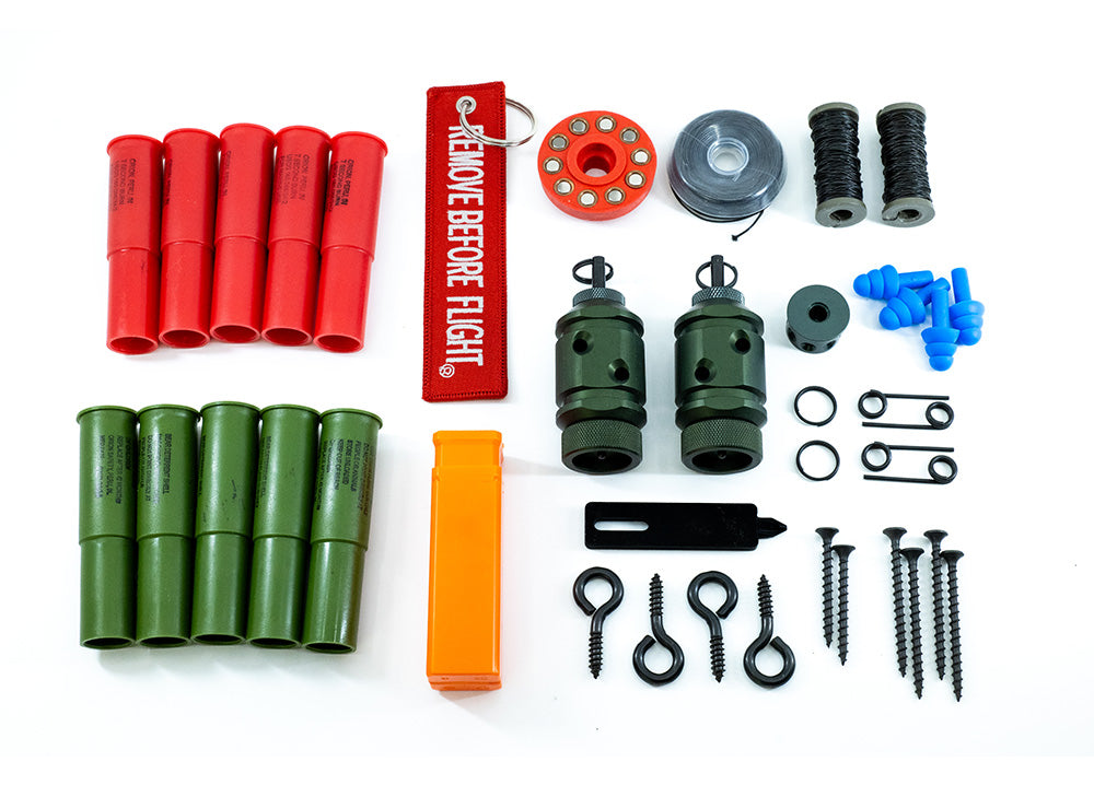 [Fith Ops Gen4 Perimeter Trip Alarm, Eye Screws, Orion Sight and Sound Shells, CCI Primers in Carrier Caddy, 75&#39; Dyneema Trip Line, Extra Pins, Extra Screws, 209 Adapter and Authur Screw Driver laid out with white background straight down view]]
