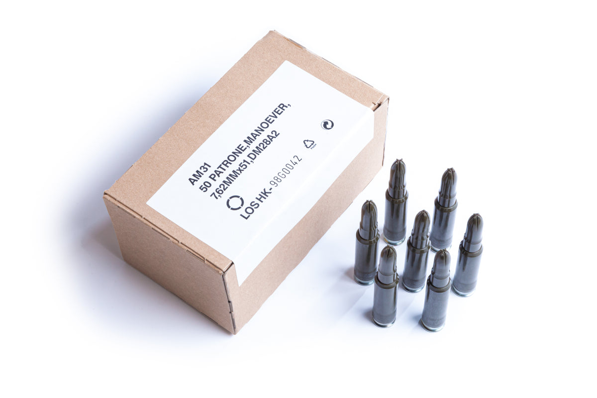 [box of blank 308 for training and mock settings/ 7 blanks standing up to show they are all plastic and have no projectile]]